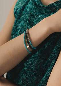 Twin armband mit grauer Süßwasserperle und Türkis - vergoldet