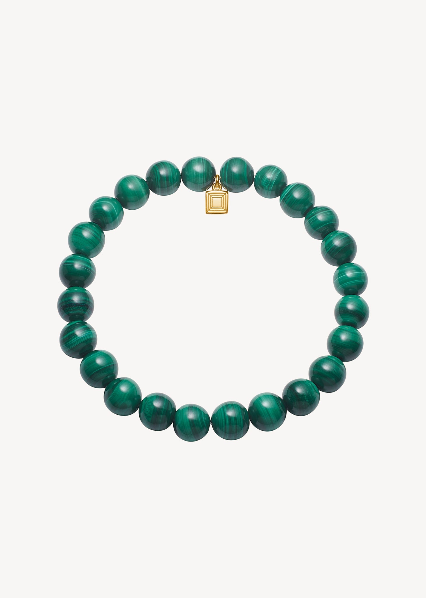 Slip on armbånd i guldbelagt sterling sølv med elastisk tråd og guld tag fra carré med grønne, runde malakit ædelsten