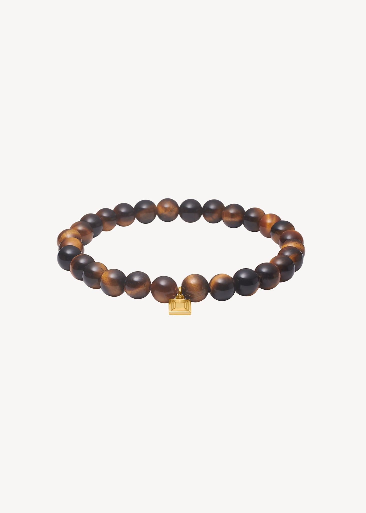 Håndlavet Lido slip-on armbånd fra carré jewellery med brune tigerøje ædelsten og guld tag