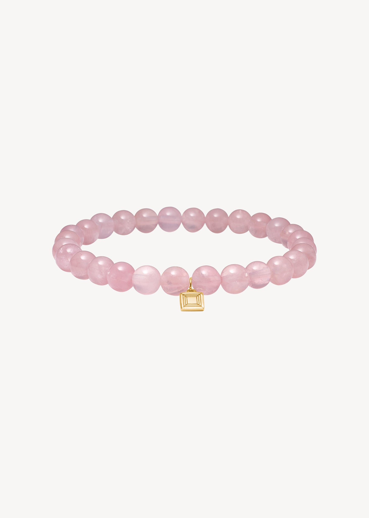 smukt armbånd i slip on stil med ægte runde rosa kvarts ædelsten i guld